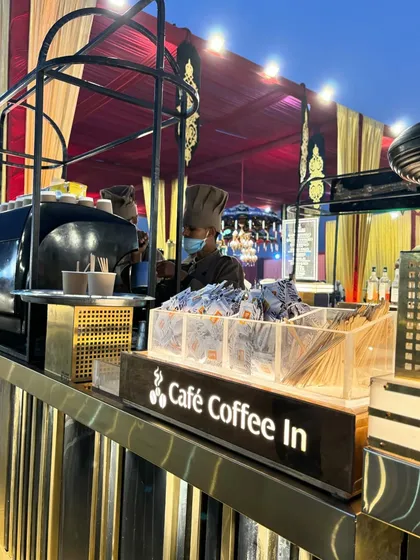 For the coffee lovers, I can set up a dedicated 'Café Coffee In' station. This bar features a professional espresso machine and a barista ready to serve hot coffee and other cafe-style beverages throughout the event.