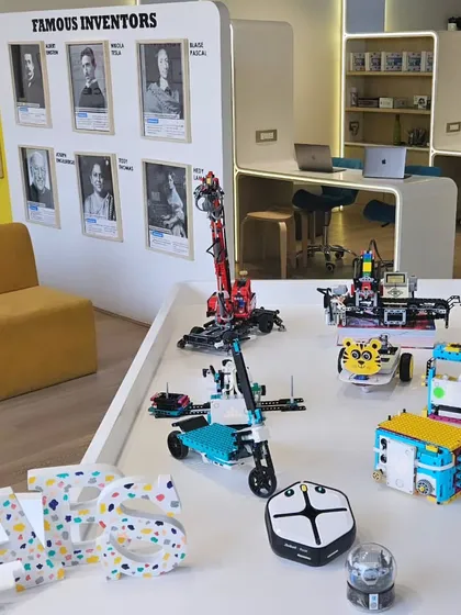 Welcome to our gallery of genius creations. Each robot on this table was built and programmed right here by my students, showcasing their skills in engineering, design, and problem-solving.