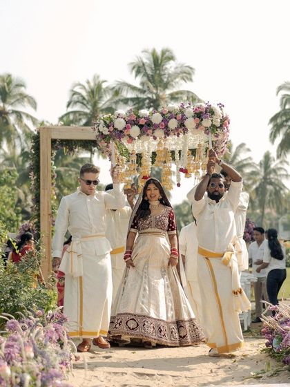The grand bridal entry. Kavi looks absolutely regal under the phoolon ki chadar, her makeup glowing in the daylight.