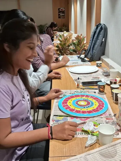 A moment of focus and fun during our Lippan art workshop for a corporate client. Art is a wonderful way to engage employees and foster creativity.