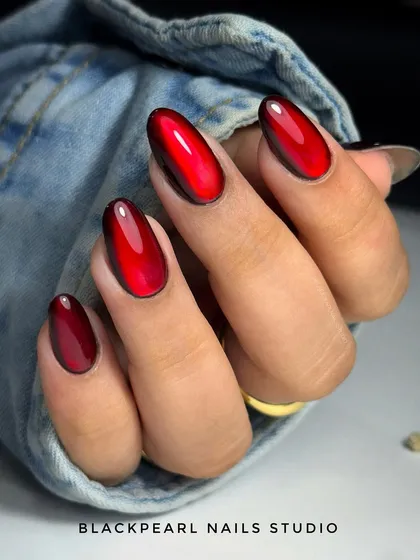 This look showcases the popular red jelly cat eye trend. I use an advanced layering technique to create a deep, magnetic glow under a glassy, high-shine finish. It’s a bold and modern style that demonstrates technical skill in creating multi-dimensional effects.