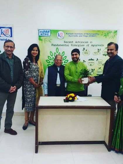 Receiving a plant as a token of gratitude at the NTPC camp. It symbolizes the growth and wellness we aim to cultivate.