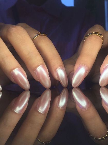 A full view of the beautiful pearlescent pink chrome nails.