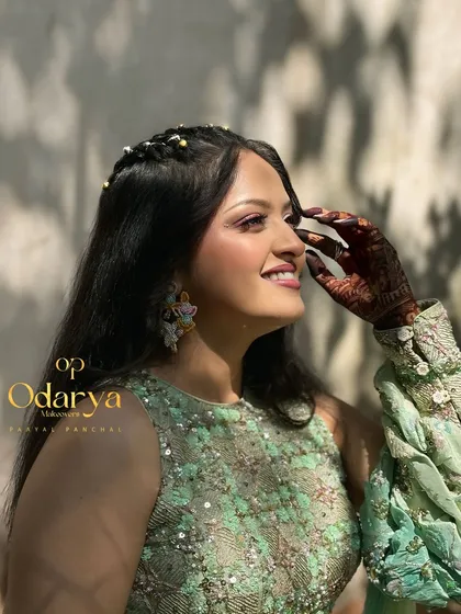 A happy, smiling bride enjoying her Haldi day. The makeup is waterproof and long-lasting to ensure she looks flawless throughout the event.