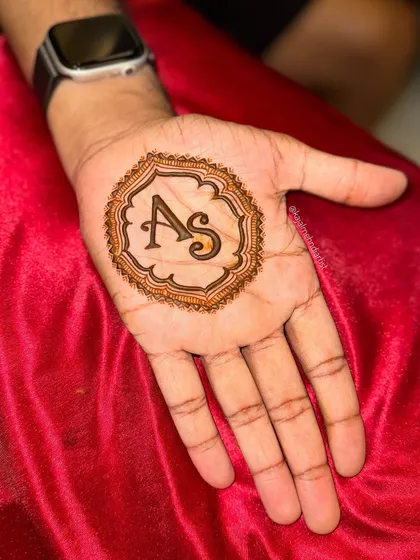 Another look at the popular initials design for grooms. It's a timeless choice that is both personal and stylish.