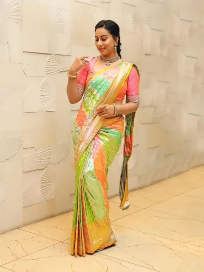 Dr. Shruthi exudes grace in this mesmerizing Rangkut Banarasi silk saree, a testament to centuries-old craftsmanship.