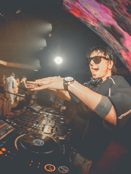 A close-up, wide-angle shot of me interacting with the crowd in Goa. It captures the fun and energy of the night.