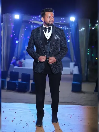 Dapper sophistication personified. Our client exudes timeless charm in our impeccable paisley patterned tuxedo, perfect for his wedding reception.