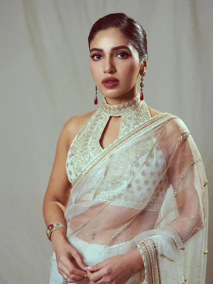 This look for Bhumi Pednekar is pure elegance. I chose this sheer white saree with a high-neck embroidered blouse, perfect for an awards show where she wanted a graceful and sophisticated Indian look.
