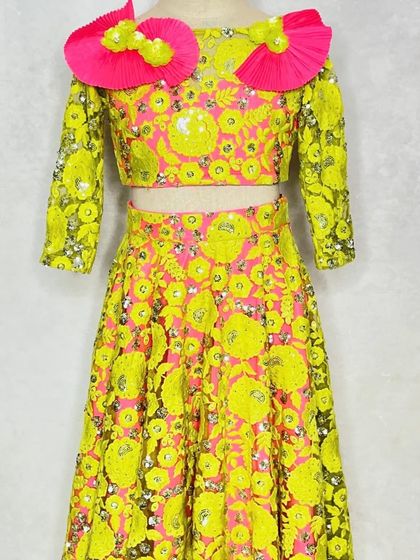 A full front view of the neon lehenga, showcasing the vibrant colors and detailed sequin work.