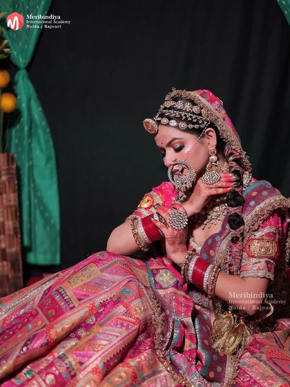 This side view shows the intricate braid and the profile contouring that enhances the bride's features.