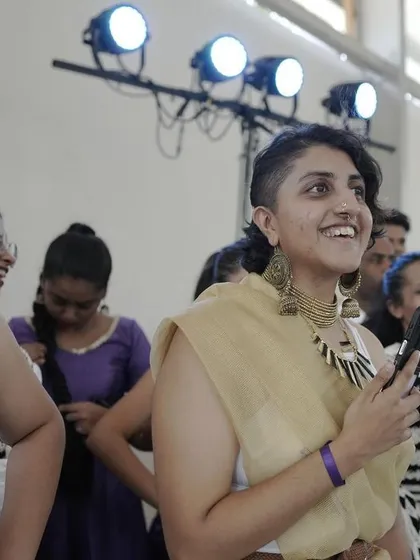 A spectator enjoying the performances, showcasing the incredible audience energy at Spectra.