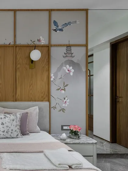 A detailed shot of the custom Chinoiserie wallpaper, showing the delicate brushwork of the flowers and the distant pagoda. This view emphasizes the bespoke artistry and serene elegance of our hand-painted wallcoverings.