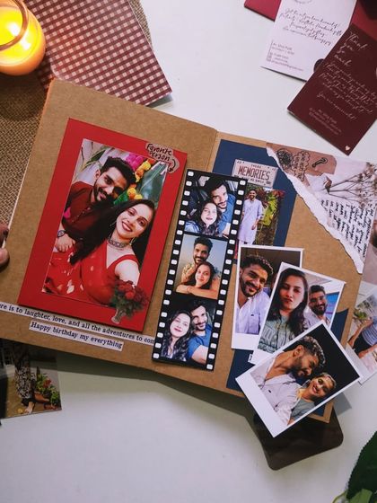 A closer look at a page from a custom flap book. I used a filmstrip-style photo layout and layered different papers to create a dynamic, scrapbook feel. Every detail is designed to bring your memories to life.