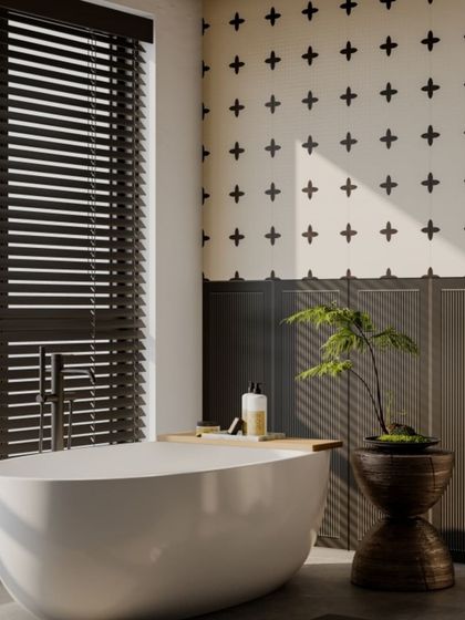 The same cross-patterned tile used in a bathroom, showing its versatility. It creates a clean, modern, and stylish backdrop for the freestanding tub.