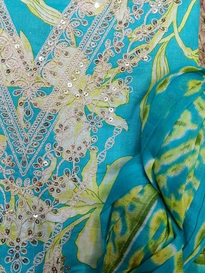 This bright and cheerful turquoise suit piece is another lovely gift idea to make her Mother's Day memorable.