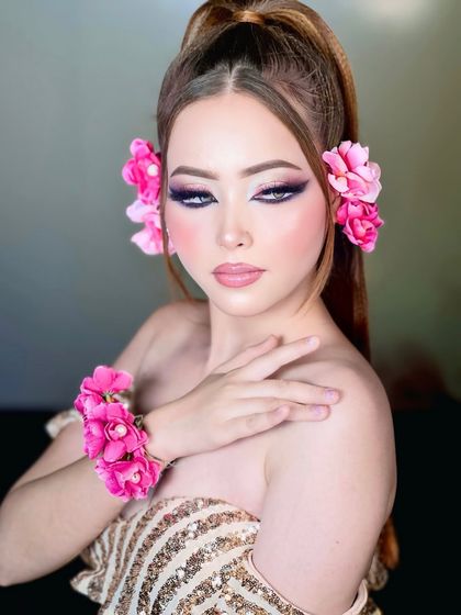A soft and delicate pose. The floral accessories and dreamy makeup come together to create a beautiful, artistic portrait.