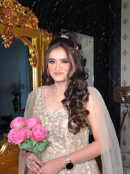 Holding a bouquet of pink roses, this engagement bride looks like she's straight out of a dream.