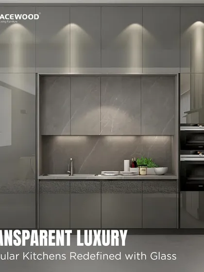 I use glass cabinetry to add a touch of transparent luxury and make a kitchen feel more open. This design features high-gloss grey cabinets with smoked glass doors and internal lighting, perfect for showcasing your finest glassware while maintaining a clean, modern look.