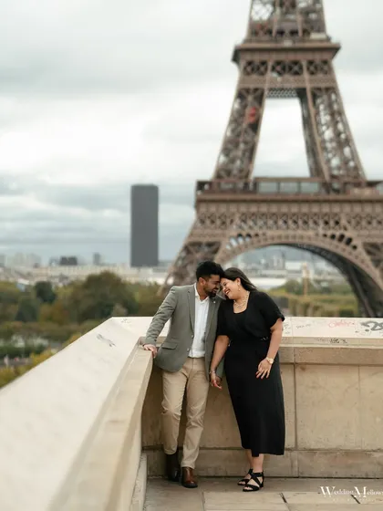 A quiet, shared moment for Varun and Aishwarya with the Paris skyline behind them. This image captures the feeling of being in your own world, even in the heart of a bustling city.