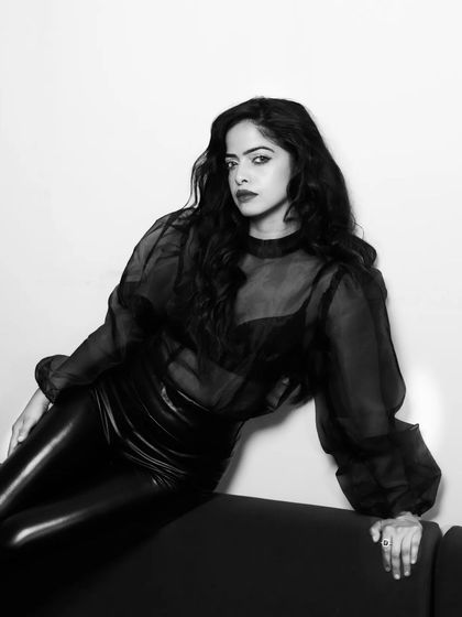 A closer crop from the same B&W series, focusing on the subject's intense gaze. This tight composition adds to the drama and intimacy of the portrait.