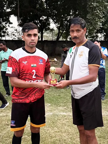 Our player receiving the Best Player award at the Champions Cup.