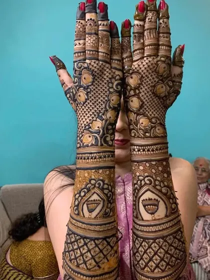 A unique design with a fish motif, surrounded by intricate jaali and floral patterns.