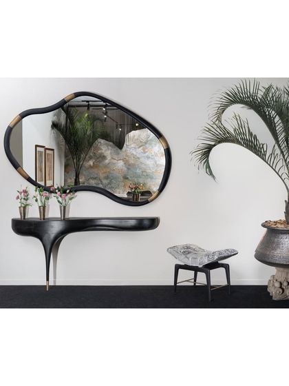 A sculptural console and mirror from our Koko collection, designed for the India Art Fair VIP Lounge. The organic shapes and dark finish create a dramatic and artistic statement, reflecting our belief that furniture can be art.