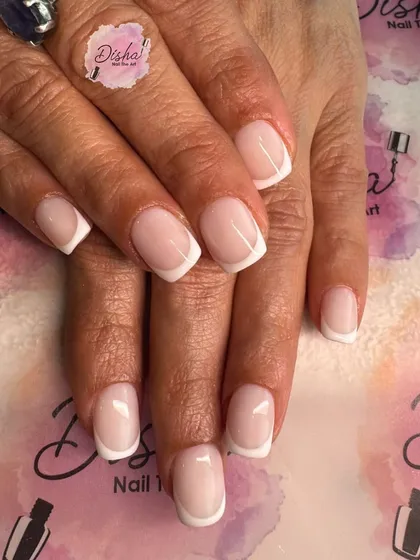 The epitome of classic elegance. A perfect, clean, and timeless French manicure with a squared-off shape.