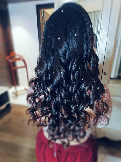 A romantic open hairstyle with soft, cascading curls. I scattered tiny pearl accessories throughout the hair to create a dreamy, ethereal effect that catches the light beautifully.