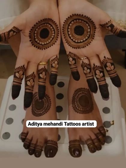 A complete set of matching mehndi for hands and feet. This design features a bold, circular mandala pattern, creating a simple yet striking look for any festive occasion.
