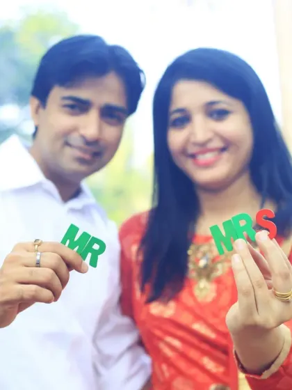 A fun and playful shot for a "save the date" or pre-wedding announcement. Using props like these "Mr" and "Mrs" letters adds a touch of personality and excitement to the photoshoot.
