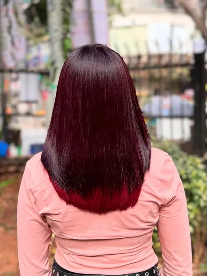 The back view shows how the bright red is hidden, creating a sleek look until the hair moves.