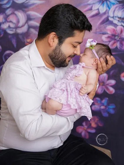 A father's love is a special kind of magic. Here, a new dad holds his tiny baby with such tenderness and awe, a beautiful portrait of the beginning of their lifelong bond.
