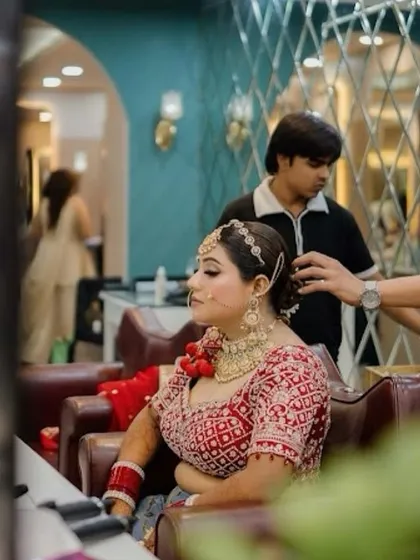 A behind-the-scenes moment as we perfect the bridal bun. This shows the care and attention to detail that goes into creating a complete, polished look for the wedding day.