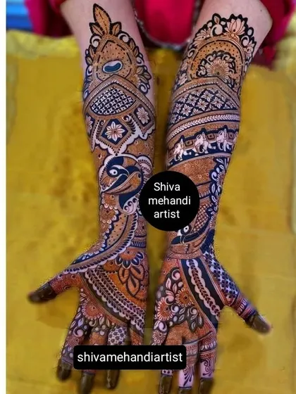 This design showcases a creative use of negative space to highlight the peacock and elephant figures. The surrounding patterns are detailed yet allow the main motifs to be the focus.