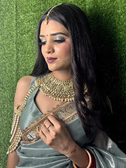 The final airbrush look, complete with soft smokey eyes and elegant jewelry. This skill is highly sought after for bridal and celebrity makeup.