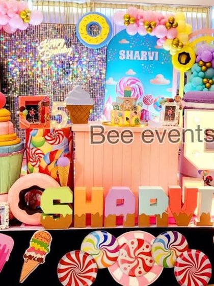 Another view of the delightful Candyland birthday decor. The light-up number '5' and the custom name blocks add a personalized touch to this fun and imaginative theme.
