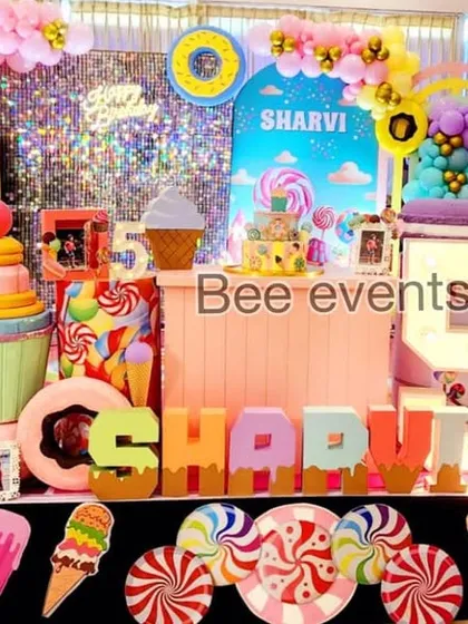 Another view of the delightful Candyland birthday decor. The light-up number '5' and the custom name blocks add a personalized touch to this fun and imaginative theme.