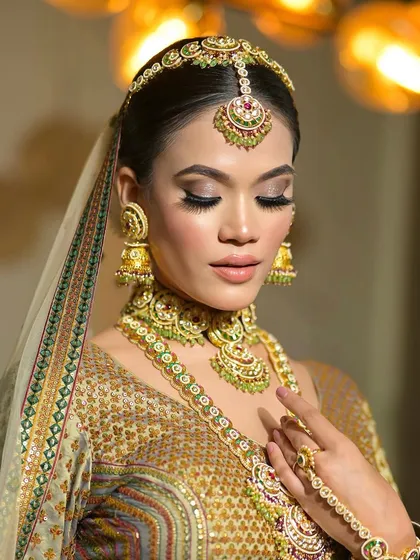 A close-up of a traditional bridal look with heavy kohl on the eyes. This is a classic choice that makes the eyes the center of attention.