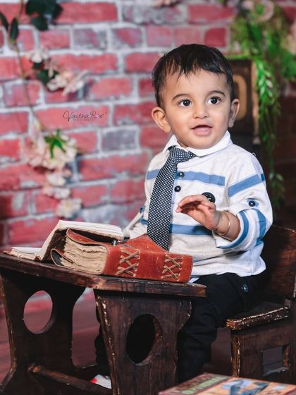 A gallery of our popular school and library theme. These images show the versatility of the brick wall backdrop, mini school desk, globe, and book props for creating a variety of scholarly and classic portraits.