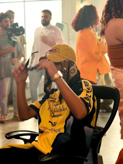 Another moment from the same shoot, just catching the vibe between takes. It's a fun and creative process.