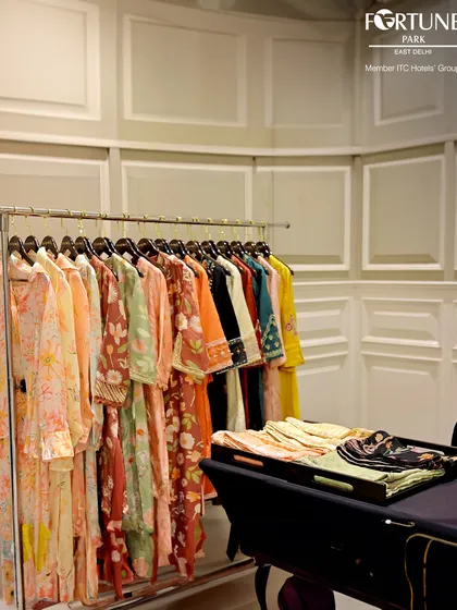 Pop-up shops are a popular feature at my themed events. This clothing rack from a local designer was part of a Women's Day celebration, offering guests a unique opportunity to shop while they socialize.