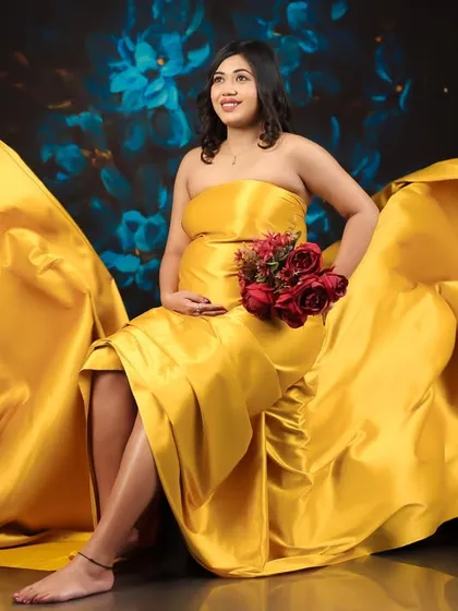 A seated pose with the yellow fabric artfully arranged, creating a beautiful and dynamic composition that feels both regal and full of life.