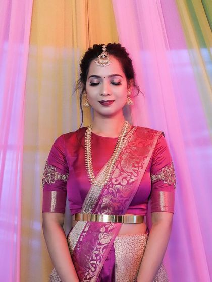 The client looking down, showing the soft waves in her hair.