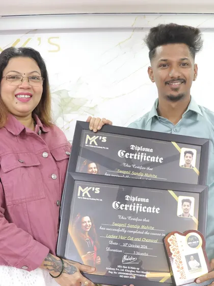 A proud graduate receiving his Diploma Certificates for Ladies Hair Cut and Chemical work. He is now a certified professional, ready for the industry.