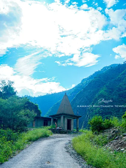 The Kawanti Bhutnaath temple under a bright blue sky. This image shows the simple, traditional stone architecture of the temple and the path leading to it, inviting a sense of pilgrimage.