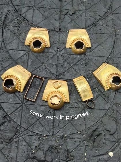 Some work in progress. These gold components are laid out on our work board, ready to be assembled into a new, beautiful piece. This is where the transformation begins.