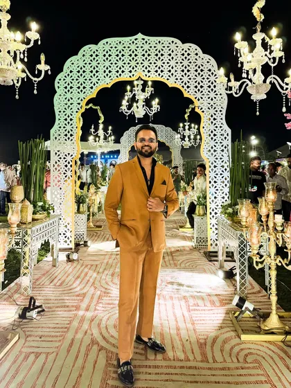 Looking sharp for a beautiful couple's wedding reception at Pushkara Resort. The right outfit is part of the performance, setting the tone for a sophisticated and fun evening.