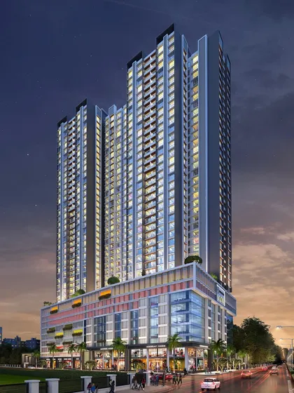 The Voraskyline Icon residential project at night. The lighting design highlights the building's facade details and its multi-level podium, which integrates retail and residential amenities.